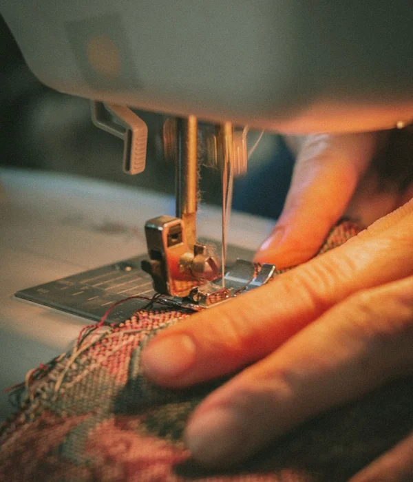 Master tailor hand-stitching luxury wool jacket