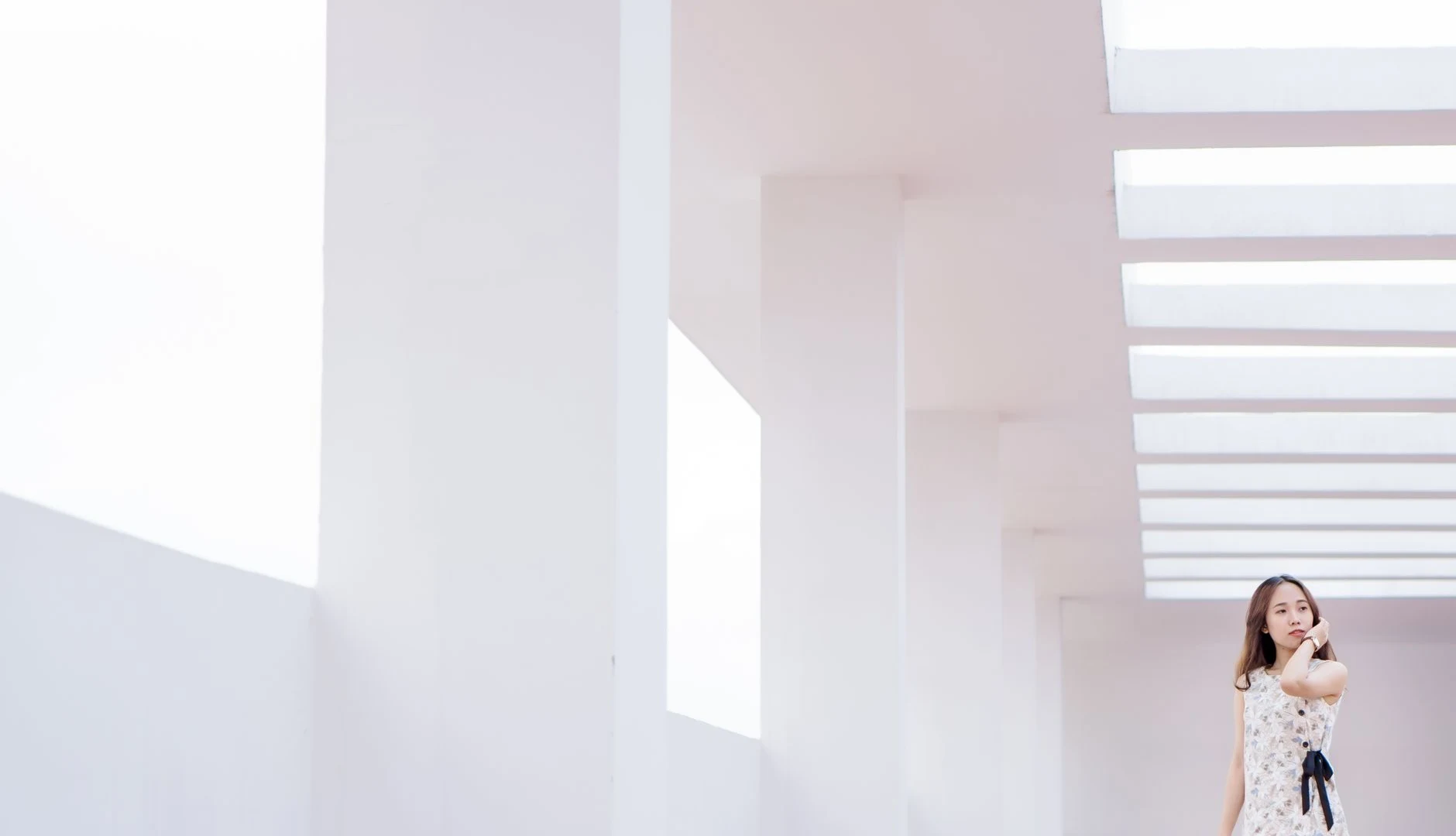 Architectural fashion model in minimalist concrete environment